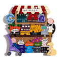 Colorful wooden shop jigsaw puzzle with Irish words and numbers for items like ice cream, bread, and flowers.