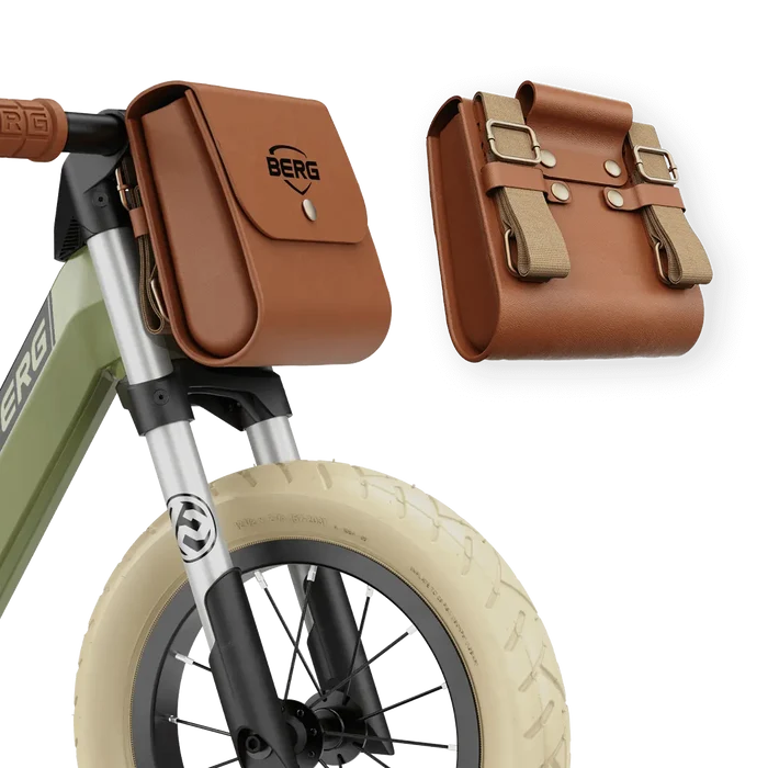 Green balance bike with cream tires and a brown BERG faux leather handlebar bag shown from the front and back.