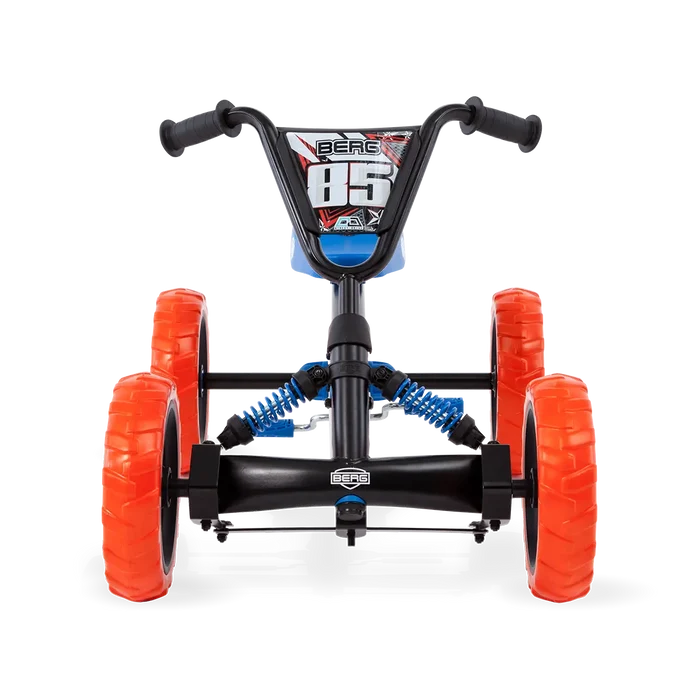 Front view of a black and blue pedal go-kart with chunky orange off-road tires and visible blue suspension springs.