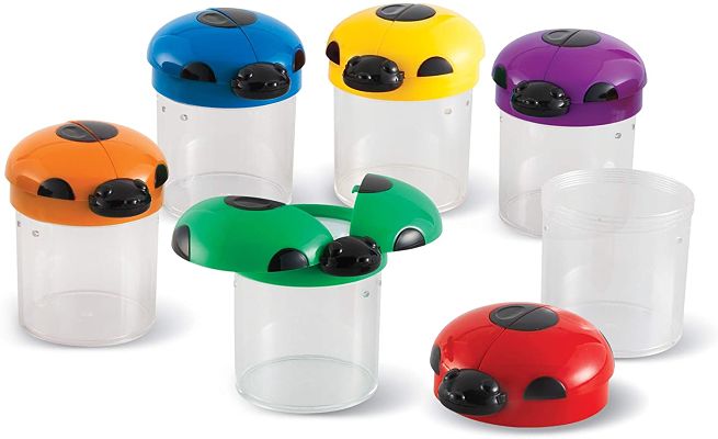 Six clear bug jars with colorful ladybug lids; one lid is open showing a built-in magnifying glass.