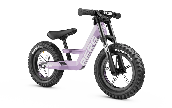 Purple balance bike with chunky knobby tires, black front forks, and white Berg logo on the frame.