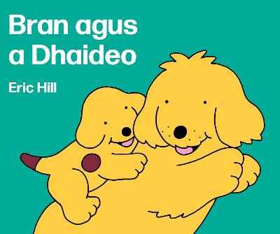 Teal book cover shows two yellow cartoon dogs hugging, one a puppy with a spot. Includes author name Eric Hill.