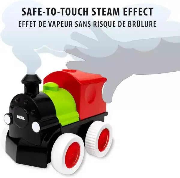 Black, green, and red BRIO toy train engine with white wheels and a safe-to-touch steam effect from its chimney.