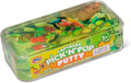 Green translucent putty with colorful fruit charms and a small brown capybara figure inside a clear rectangular box.
