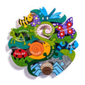 Circular wooden puzzle of colorful garden creatures with Irish names on green leaf and insect-shaped pieces.