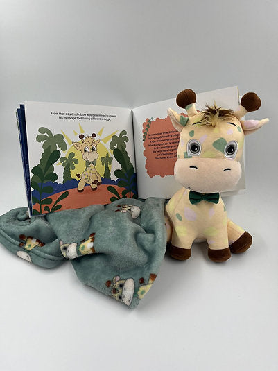 Plush spotted giraffe with a green bow tie, an open storybook, and a matching teal patterned fleece blanket.