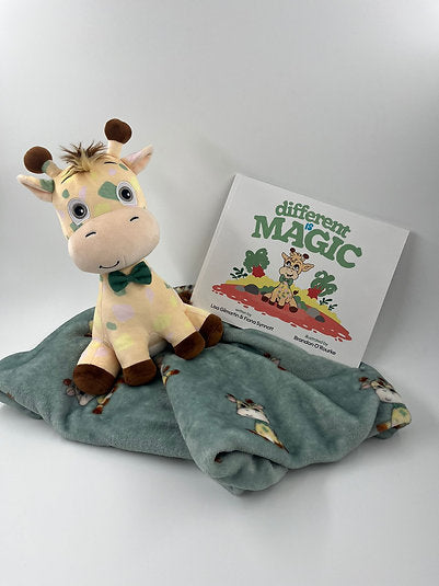 Plush giraffe with a green bow tie, teal giraffe-print blanket, and Different is Magic children's book.