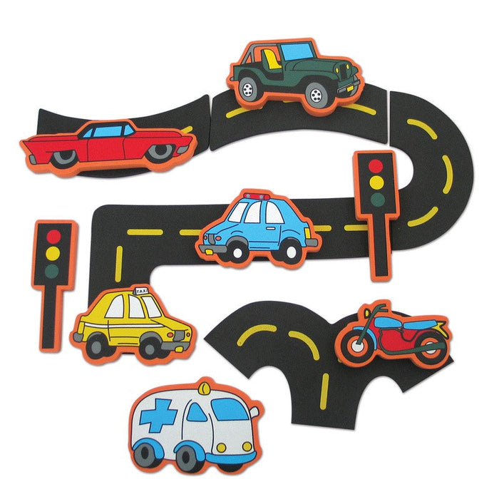 Colorful foam bath toy set featuring a car, taxi, ambulance, motorcycle, black road tracks, and traffic light signals.