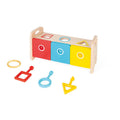 Wooden shape sorter with red, blue, and yellow drawers, matching colored keys, and geometric cutouts on top.