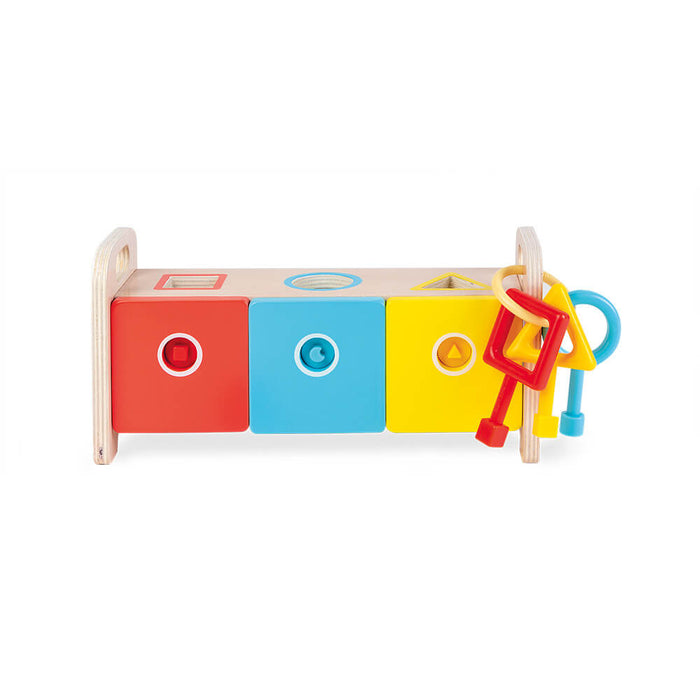 Wooden toy box with red, blue, and yellow doors, shape cutouts on top, and matching colorful keys on a side handle.