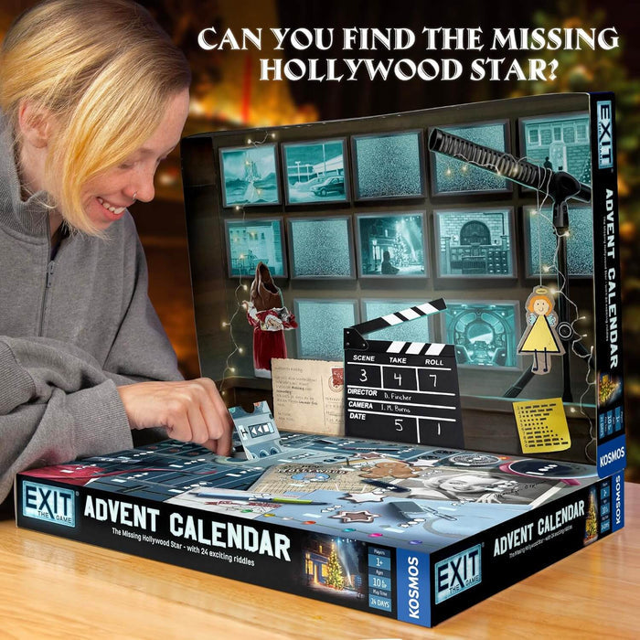 Woman opening a blue movie-themed advent calendar box with a film set backdrop, clapperboard, and boom microphone.