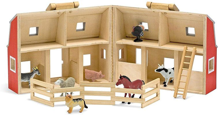 Open red wooden toy barn with two floors, stalls, farm animals, a ladder, and a fence.