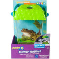 Clear bug habitat with a textured green lid and orange handle, shown in its purple and blue retail packaging.