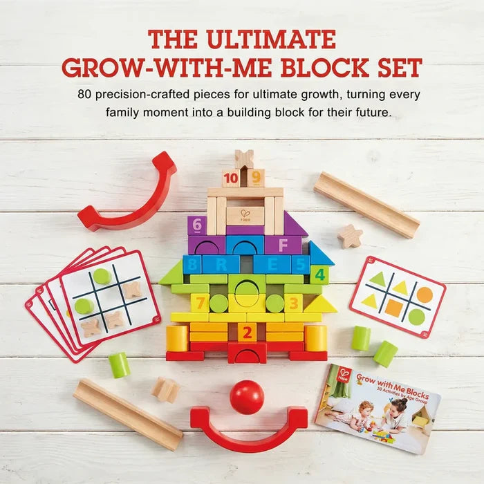 80 colorful wooden blocks with numbers and letters, activity cards, and wooden tracks on a white plank background.