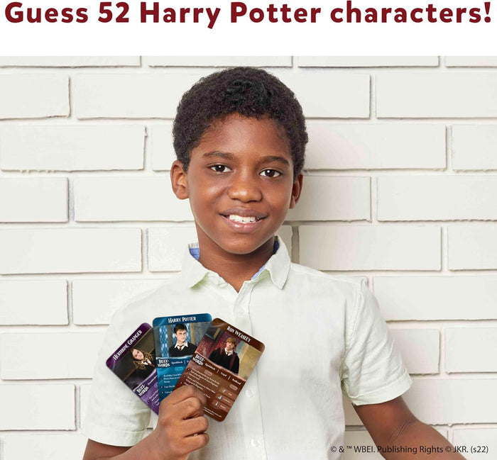 Boy holding Harry, Ron, and Hermione cards against a white brick wall. Text: Guess 52 Harry Potter characters!
