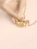 HELPING HANDS NECKLACE