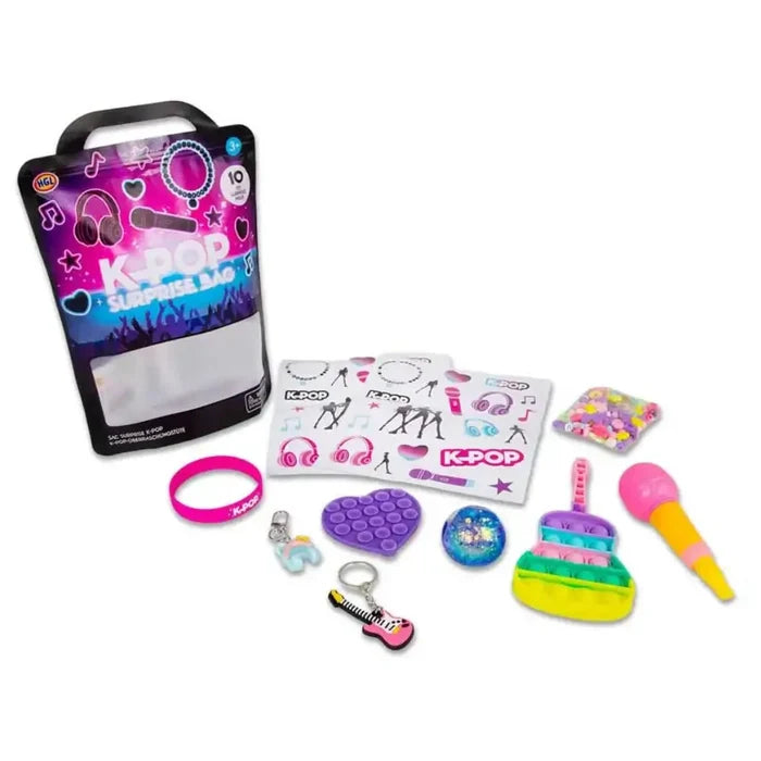 Black surprise bag with neon K-Pop text, plus a toy microphone, pop-it fidgets, and stickers in bright colors.