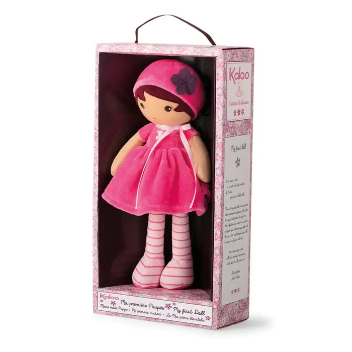Soft plush doll wearing a pink dress and hat with striped legs, inside a decorative pink floral display box.