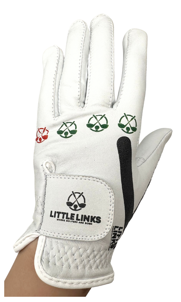 White leather kids golf glove featuring red and green knuckle icons and a Little Links logo on the velcro strap.