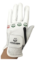 White leather kids golf glove featuring red and green knuckle icons and a Little Links logo on the velcro strap.