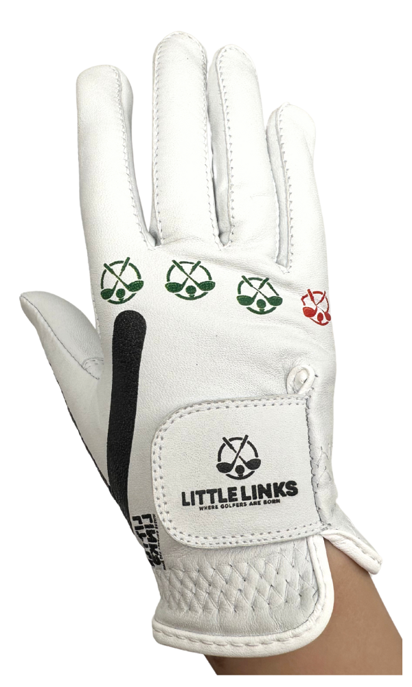 White kids' golf glove with black grip strip, velcro strap with logo, and green and red knuckle icons for training.