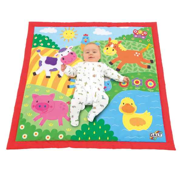 Brightly colored square farm playmat with a red border, featuring illustrations of a cow, horse, pig, and duck.