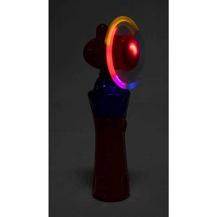 Handheld red and blue toy with a spinning top emitting a glowing circle of red, orange, and purple light.