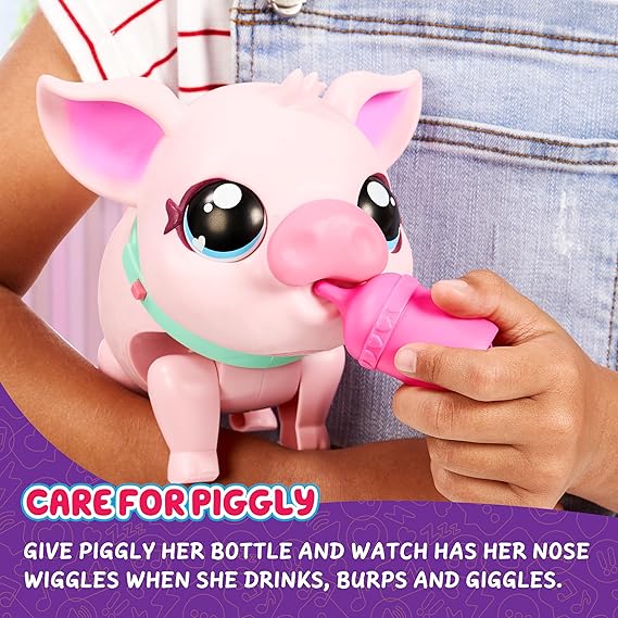 Pink toy pig with large eyes and a mint collar being fed a pink bottle by a child.