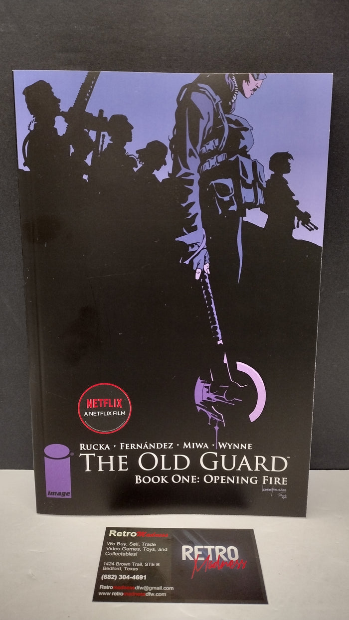 (MATURE) The Old Guard Book One: Opening Fire by Greg Rucka – New Paperback (Minor Wear)