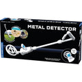 White toy metal detector on its black packaging box with circular photos of beach and woods treasure hunting.