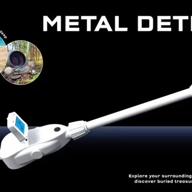 White plastic toy metal detector with a digital screen, shown against a black background with a treasure hunt scene.