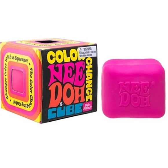 Bright pink squishy cube with embossed text next to its colorful, retro-themed square box packaging.
