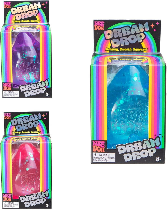 Glittery purple, pink, and blue teardrop-shaped squeeze toys in vibrant, rainbow-themed boxes.