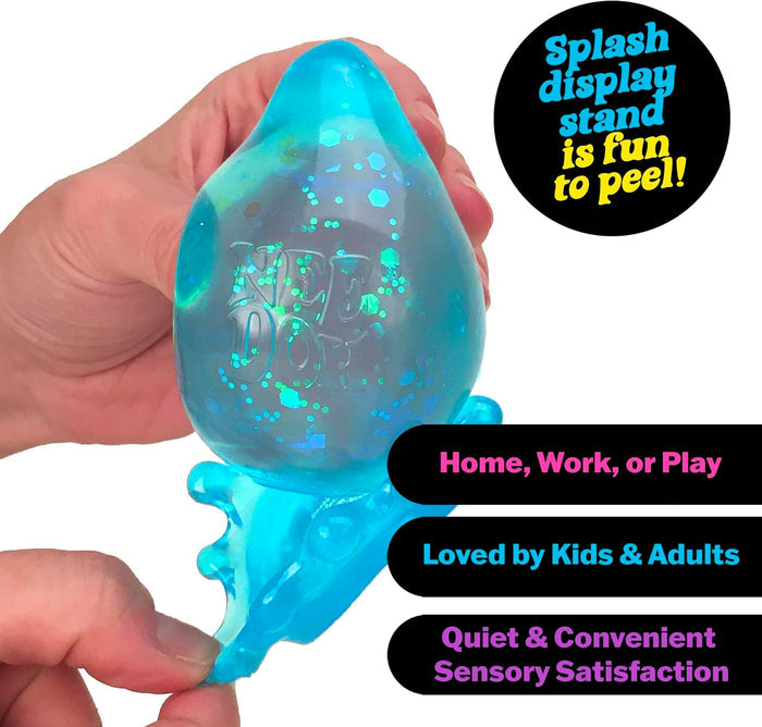 Hand holding a blue glittery teardrop-shaped toy being peeled off a matching splash-shaped base.