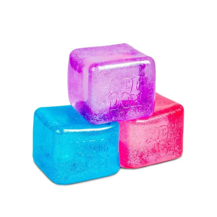 Three sparkling, translucent squishy cubes in blue, pink, and purple stacked together.