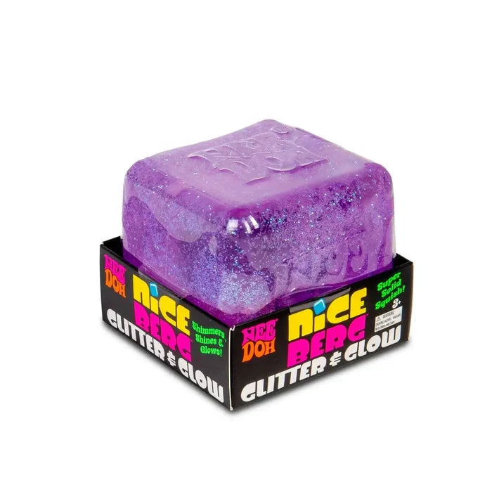 Translucent purple glitter cube-shaped toy with rounded edges in a black display box with neon text.