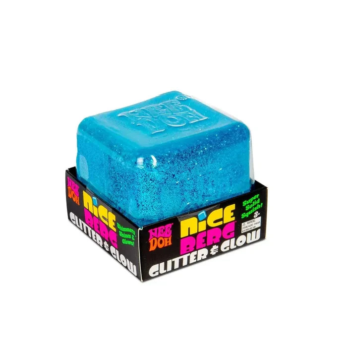 Translucent blue glittery cube squishy toy in a black and yellow cardboard display box.