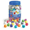 Clear jar of 120 colorful round figures with open mouths in various colors, scattered across a white surface.