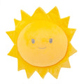 Bright yellow sun-shaped plush cushion with an embroidered smiling face and soft triangular rays.