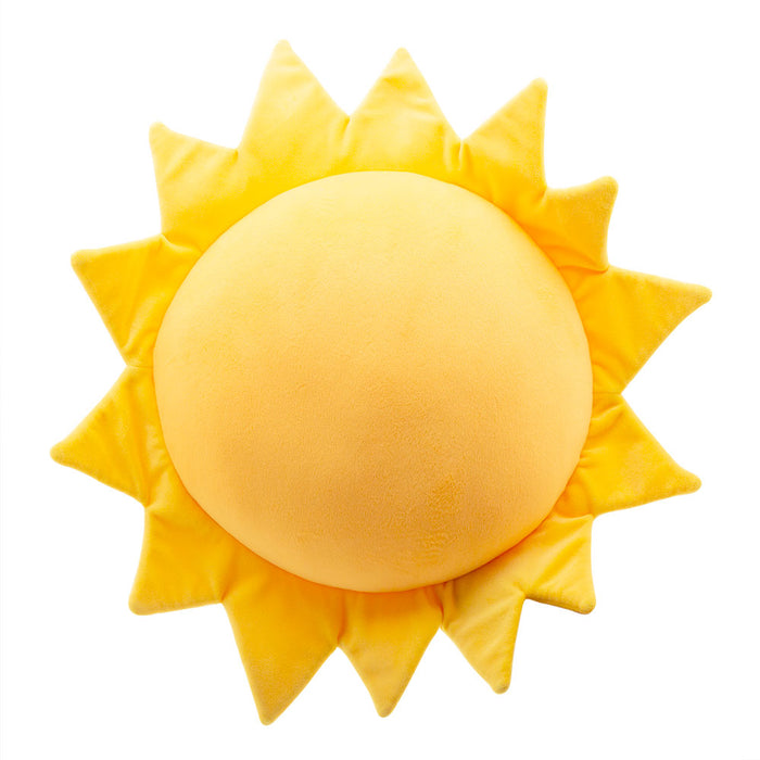 Soft yellow plush sun cushion with a round center and pointed rays against a plain white background.