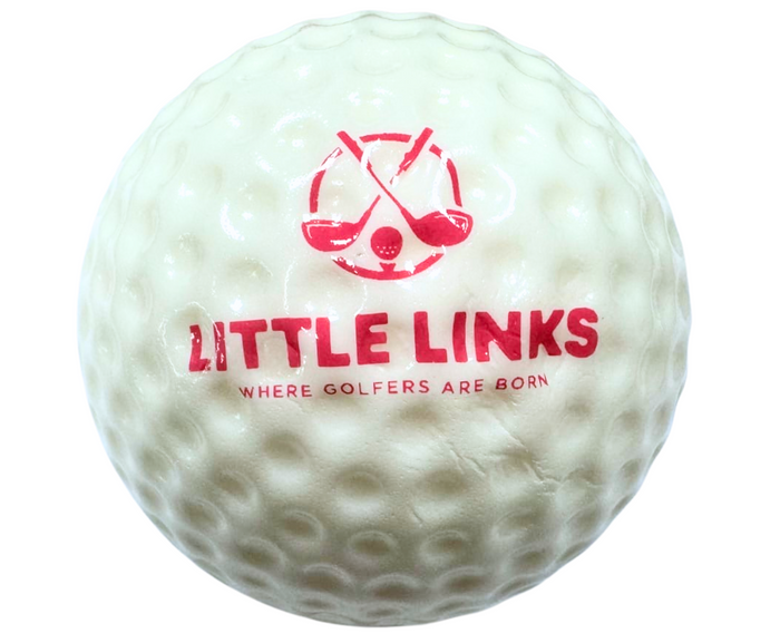 White dimpled foam golf ball with red logo featuring crossed clubs and text LITTLE LINKS WHERE GOLFERS ARE BORN.