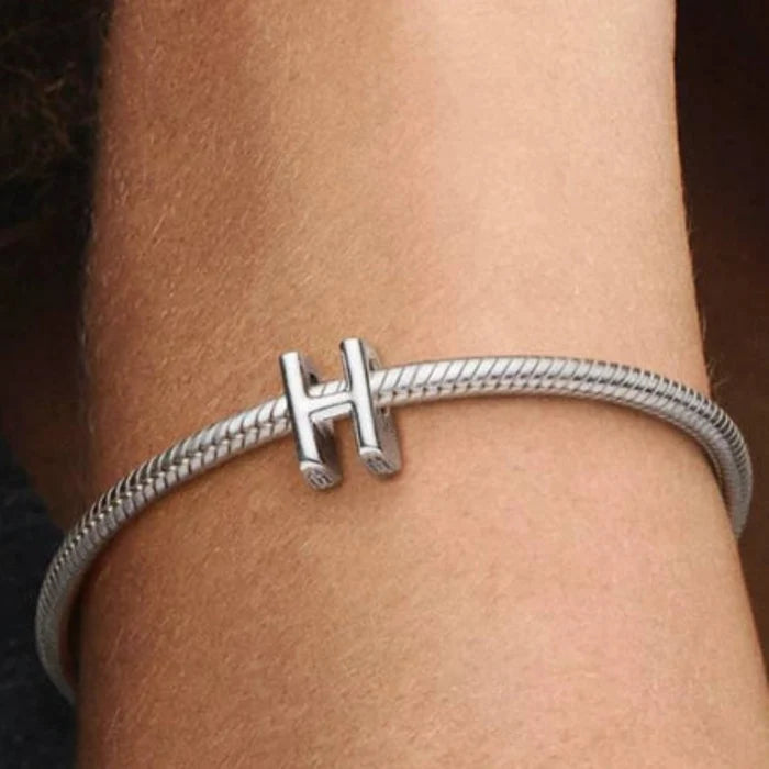 This Pandora Letter Charm - “H” brings a meaningful and personal element to your jewelry collection.
