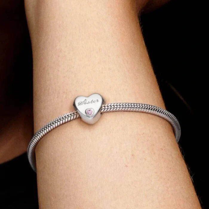 This Pandora Sister Heart Charm celebrates the special bond shared between sisters.