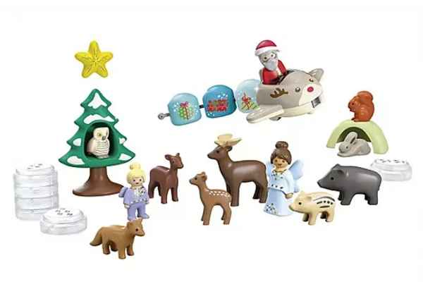 Vibrant toy set featuring Santa in a reindeer plane, various forest animals, an angel, and a green tree.