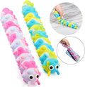 Marbled pink and blue caterpillar pop-it toys with suction cups and googly eyes shown sticking to a phone and stretched.