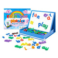 Colorful magnetic letters spelling words on a white board inside a blue case, next to the rainbow-themed box.