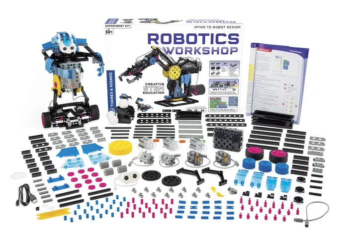 STEM kit with a white box, two built robots, and hundreds of colorful plastic gears, motors, and building components.