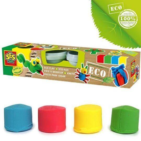 Blue, red, yellow, and green play dough mounds in front of a cardboard box featuring eco-friendly labels and models.