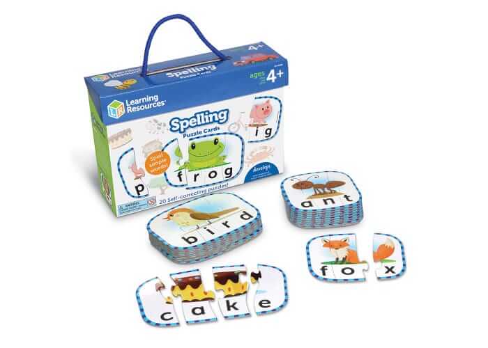 Blue box of spelling puzzles with illustrated interlocking cards for words like bird, ant, cake, and fox.