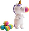 White toy unicorn with purple mane and gold horn, firing a rainbow foam ball, plus four extra balls.